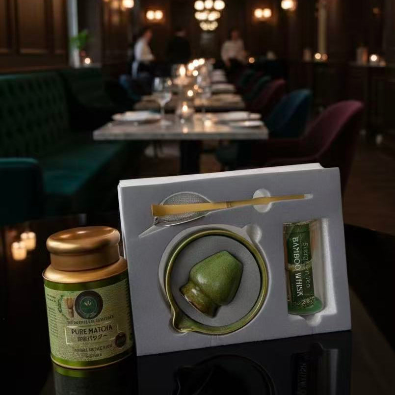 Pure Matcha Premium 200g bundle with authentic ceramic matcha set, chashaku bamboo scoop, and tamis sifter in luxury lounge setting